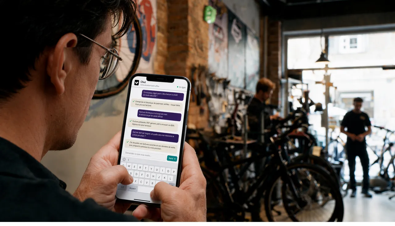 A shop owner talking to Chut from their phone